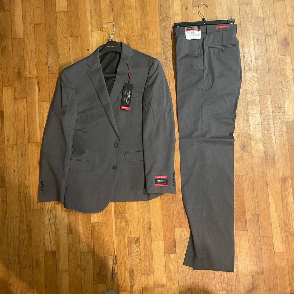 Kenneth Cole slim grey 2 piece suit. Size 34 pants, 44 regular jacket. New!